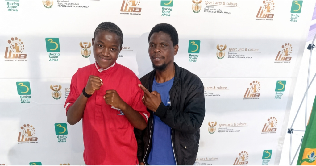 Mpumalanga featherweight boxer Nosimphiwe Danger Zone with her coach and manager Buti Isaac Dhlamini (Image: Supplied)